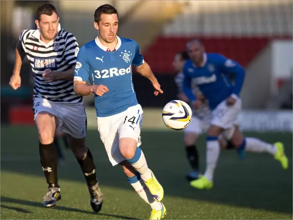 Rangers Nicky Clark vs. Queens Park's Tony Quinn: Intense Face-off in Scottish League Cup Clash at Excelsior Stadium