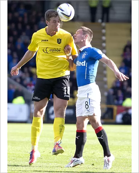 Tense Encounter: Ian Black and Jordan White Face Off Between Livingston and Rangers in Scottish Championship