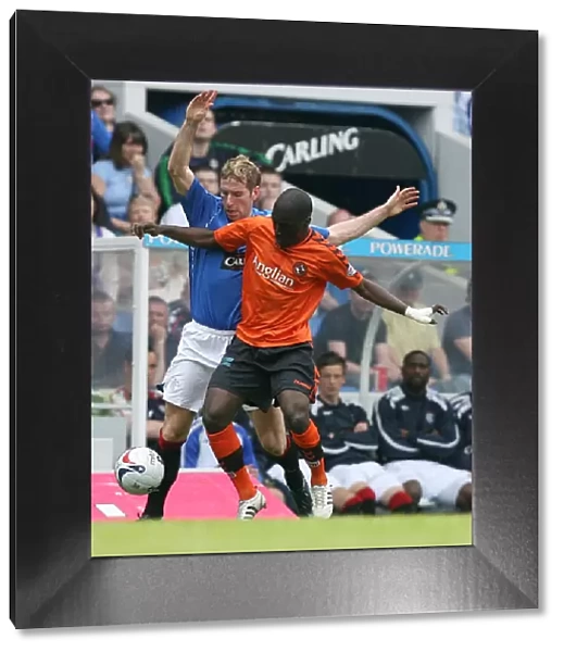 Intense Battle for the Ball: Kirk Broadfoot vs Morgaro Gomis at Ibrox - Rangers 3-1 Victory