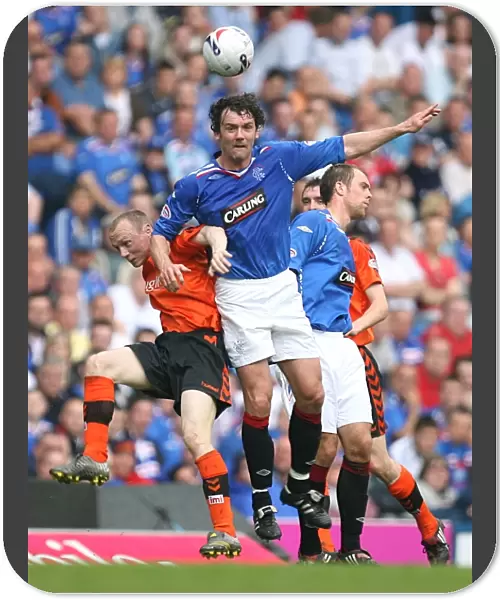 Intense Rivalry: Flood vs. Dailly - Rangers vs. Dundee United's Battle for the Ball (3-1) at Ibrox