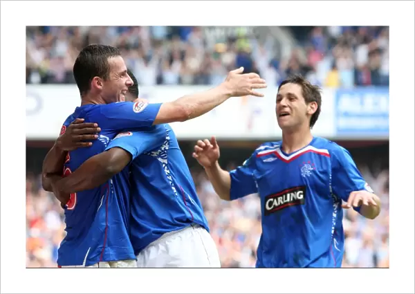 Rangers Triumph: Darcheville, Ferguson, and Furman: Celebrating the Third Goal Against Dundee United (3-1)