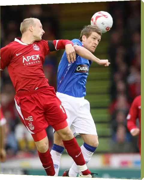 Steven Davis vs. Stewart Duff: A Clash in the Clydesdale Bank Premier League as Aberdeen Takes a 2-0 Lead over Rangers