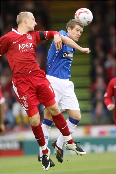 Steven Davis vs. Stewart Duff: A Clash in the Clydesdale Bank Premier League as Aberdeen Takes a 2-0 Lead over Rangers