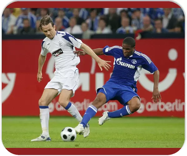 A Tight Battle for the Ball: Sasa Papac vs. Jefferson Farfan - Schalke 04 Takes the Lead (1-0) in Pre-Season Clash at Veltins Arena