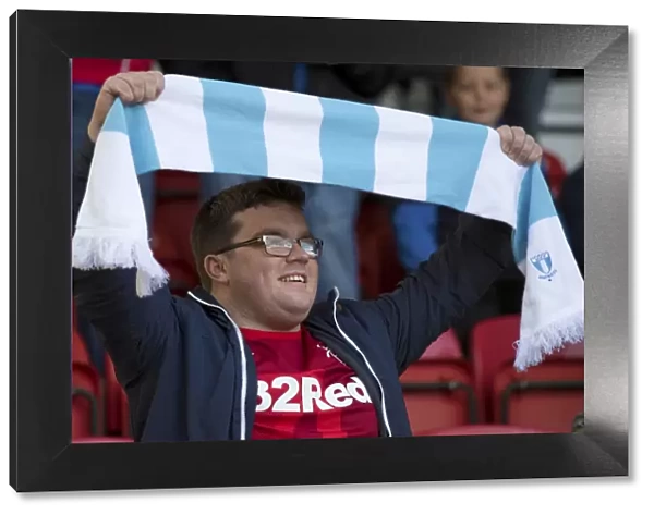 Passionate Rangers Fan Waves Malmo Scarf at Airdrieonians League Cup Match