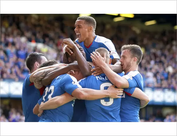 Rangers Football Club: Martyn Waghorn's Thrilling Penalty Celebration with Team Mates - Ladbrokes Championship: Rangers vs Raith Rovers at Ibrox Stadium