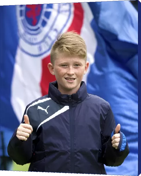 Rangers FC: A Fan and Ball Boy Amidst the Thrills of the Ladbrokes Championship Match at Ibrox Stadium
