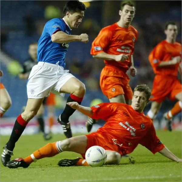 Rangers Secure Hard-Fought 2-1 Victory Over Dundee United (06 / 12 / 03)