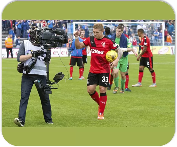 Rangers Championship Victory: Martyn Waghorn Celebrates with Match Ball at Cappielow Park