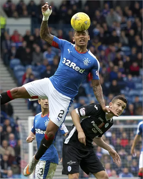 Soaring High: An Epic Heading Moment by Rangers James Tavernier at Ibrox Stadium