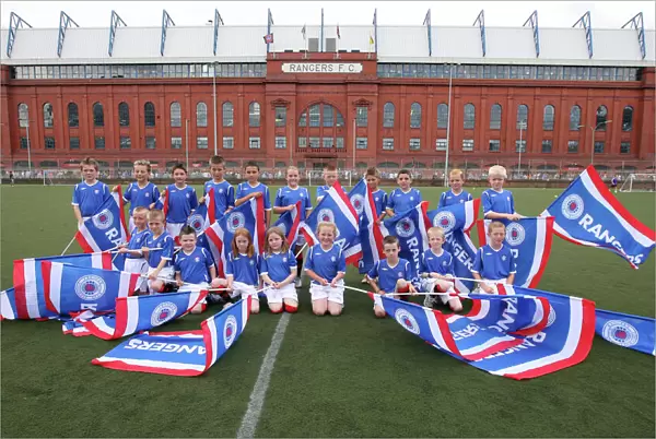 Rangers Football Club vs FBK Kaunas: Ibrox - Flag Bearers Guarding the Field in Champions League Second Qualifying Round (0-0)