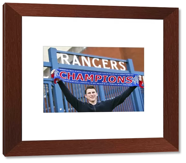 Rangers Fan Celebrates Championship Win with Champions Flag at Ibrox Stadium