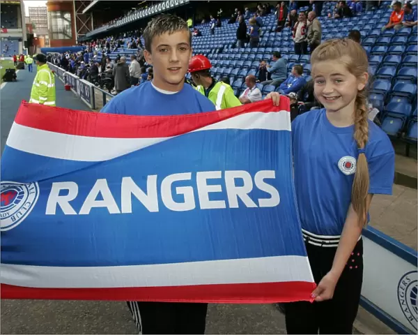 Rangers Football Club: Flag Bearers Celebrate Victory in Rangers 2-0 Hearts Clydesdale Bank Premier League Match