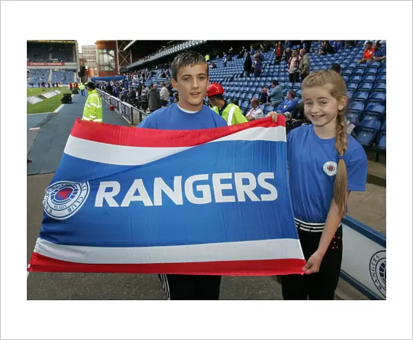 Rangers Football Club: Flag Bearers Celebrate Victory in Rangers 2-0 Hearts Clydesdale Bank Premier League Match