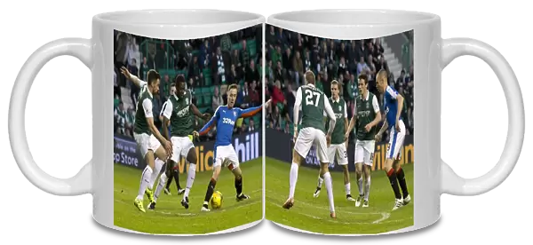 Intense Rivalry: Barrie McKay's Battle for the Ball in Rangers vs Hibernian's Championship Clash at Easter Road