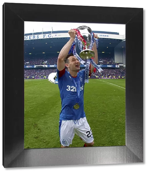 Rangers Football Club: Champions - Jason Holt Triumphantly Lifts the Ladbrokes Trophy at Ibrox Stadium