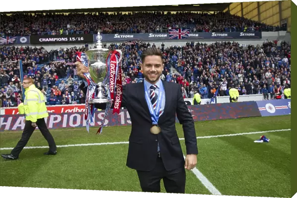 Harry Forrester's Triumph: Celebrating with the Ladbrokes Championship Trophy at Ibrox Stadium