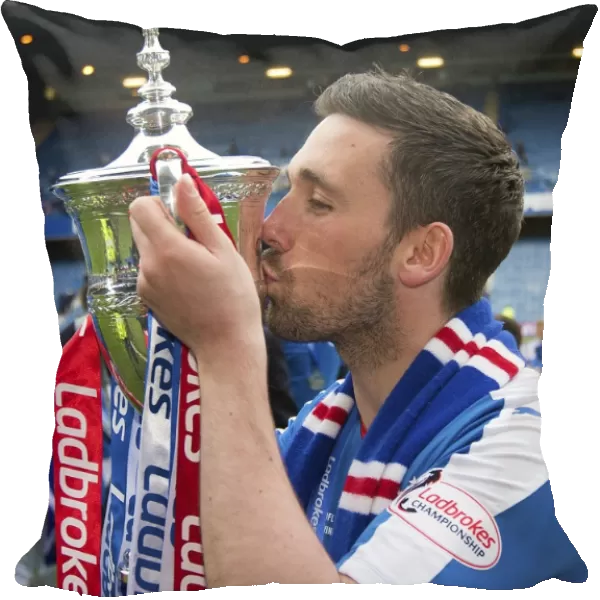 Nicky Clark's Triumphant Moment with the Ladbrokes Championship Trophy at Ibrox Stadium