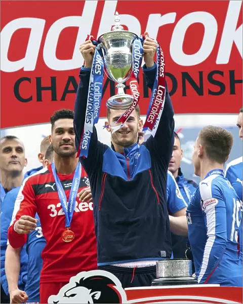 Dominic Ball Celebrates with the Ladbrokes Championship Trophy at Ibrox Stadium