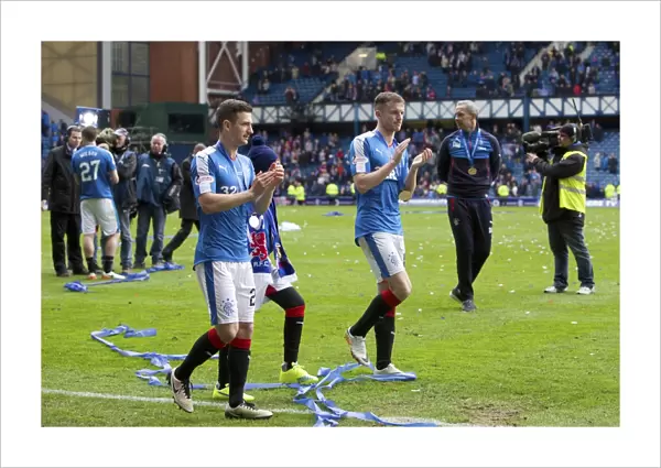 Champions League Bound: Euphoric Celebration of Rangers Holt and Halliday with the Scottish Championship Trophy