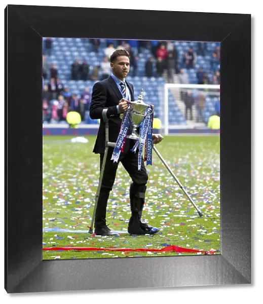 Harry Forrester's Championship Triumph: Celebrating with the Ladbrokes Trophy at Ibrox Stadium
