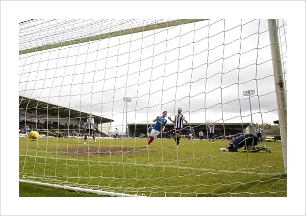 Thrilling Goal: Rangers Jason Holt Scores Past St. Mirren's Jamie Langfield in Ladbrokes Championship Match