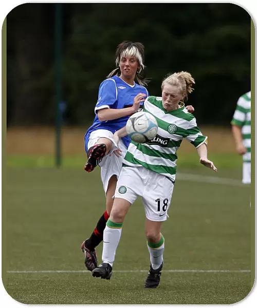Intense Moment: Ashley McCalum Tackles Laura Cheshire in Celtic vs Rangers Ladies Football Match