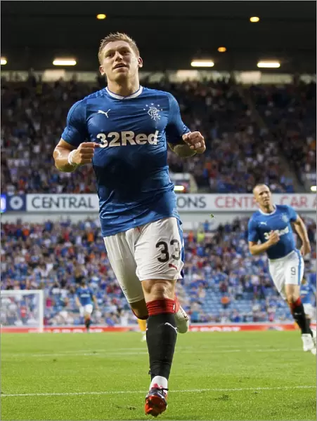 Rangers Martyn Waghorn: Celebrating Glory with a Goal in the Betfred Cup Match against Annan Athletic at Ibrox Stadium