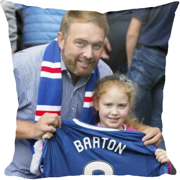 Young Rangers Fan Amidst the Ibrox Crowd, Donning Joey Barton's Shirt during a Premiership Match