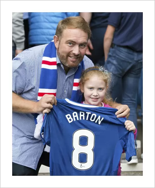 Young Rangers Fan Amidst the Ibrox Crowd, Donning Joey Barton's Shirt during a Premiership Match