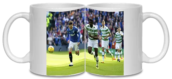 Intense Rivalry: Joe Garner Chases the Ball in the Rangers vs Celtic Clash at Celtic Park