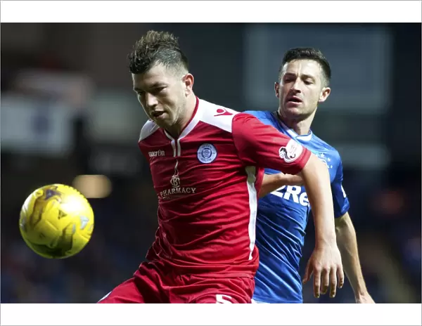Intense Moment: Holt vs. Brownlie in Rangers vs. Queen of the South's Betfred Cup Quarterfinal Clash at Ibrox Stadium
