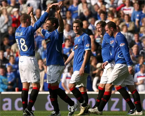 Rangers Football Club: Miller and Novo Celebrate Second Goal Against Motherwell in SPL Clydesdale Bank Match at Ibrox