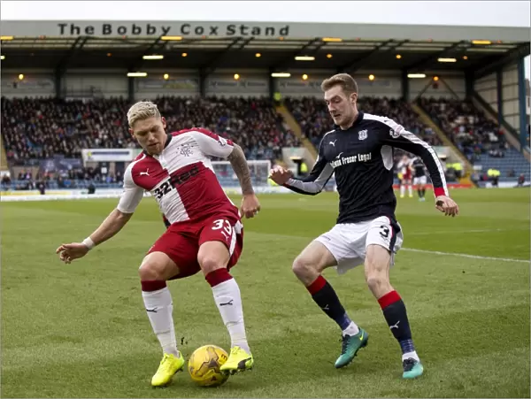 Rangers Waghorn Shields Ball from Holt in Intense Ladbrokes Premiership Clash at Dens Park