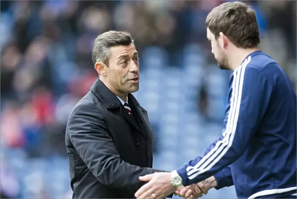 Pedro Caixinha and Martin Canning: A Post-Match Handshake at Ibrox Stadium