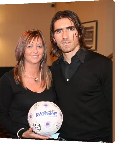 Rangers Football Club's Pedro Mendes Celebrates with Charity Race Night Winner (2008)