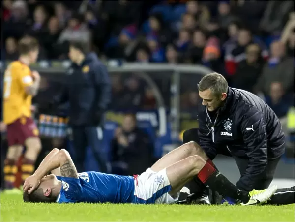 Rangers Ryan Jack Receives On-Field Treatment After Suffering Injury in Intense Rangers vs Motherwell Clash at Ibrox Stadium
