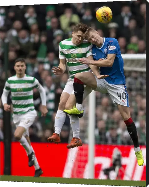 Ross McCrorie Soars Over James Forrest in the Intense Celtic vs Rangers Rivalry