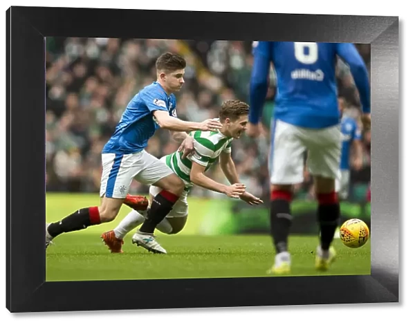 Intense Rivalry: Declan John Fouls James Forrest in Rangers vs Celtic Clash at Celtic Park