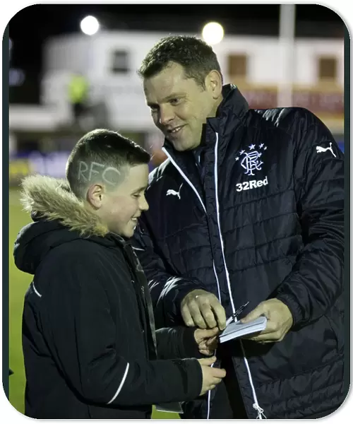 Rangers Graeme Murty Inspects Unique Fan Haircut at Fraserburgh's Bellslea Park during Scottish Cup Match (2003)