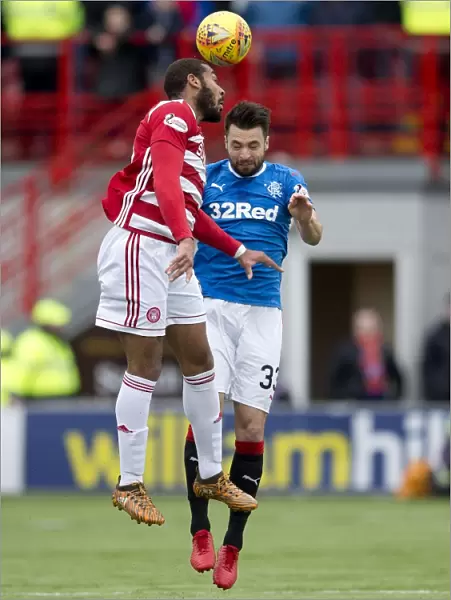 Rangers Russell Martin Soaring High: Heading the Ball in Ladbrokes Premiership Clash at The SuperSeal Stadium