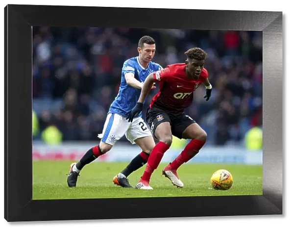 Intense Rivalry: Holt Fights for the Ball at Ibrox - Rangers vs Kilmarnock