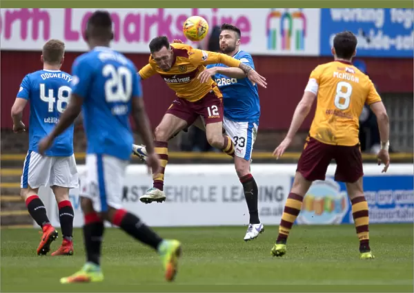 Rangers Russell Martin Soaring Over Rival Ryan Bowman in Epic Motherwell Clash