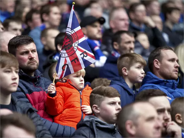 Passionate Young Rangers Fan Waving Union Jack at Ibrox Stadium during Rangers vs Dundee Match