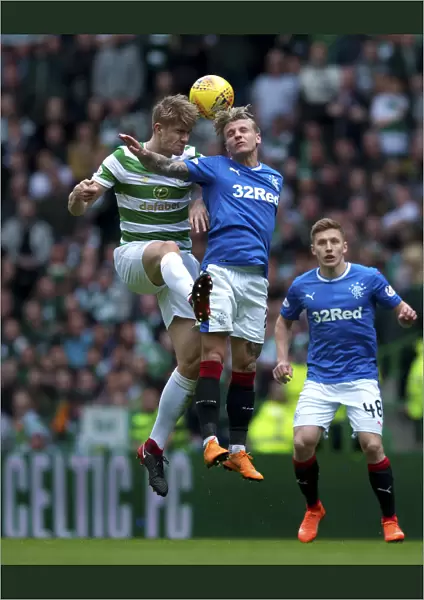 Thrilling Moment: Jason Cummings Soars Over Kris Ajer in Intense Celtic vs Rangers Rivalry (Ladbrokes Premiership)