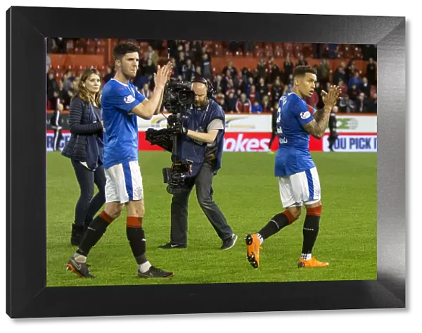 Rangers Players Sean Goss and James Tavernier Celebrate with Fans at Pittodrie Stadium