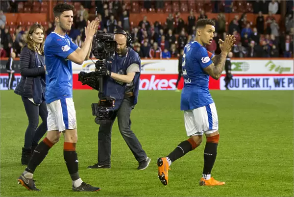 Rangers Players Sean Goss and James Tavernier Celebrate with Fans at Pittodrie Stadium