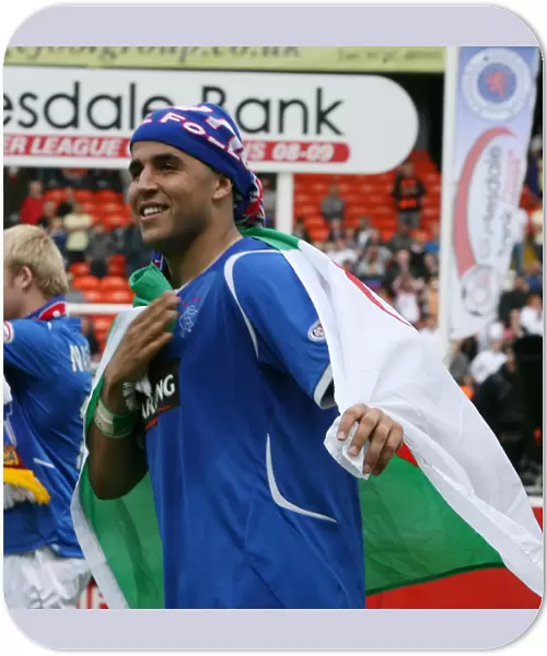 Rangers Title Triumph: Madjid Bougherra's Euphoric Celebration at Tannadice (2008-09 Scottish Premier League)