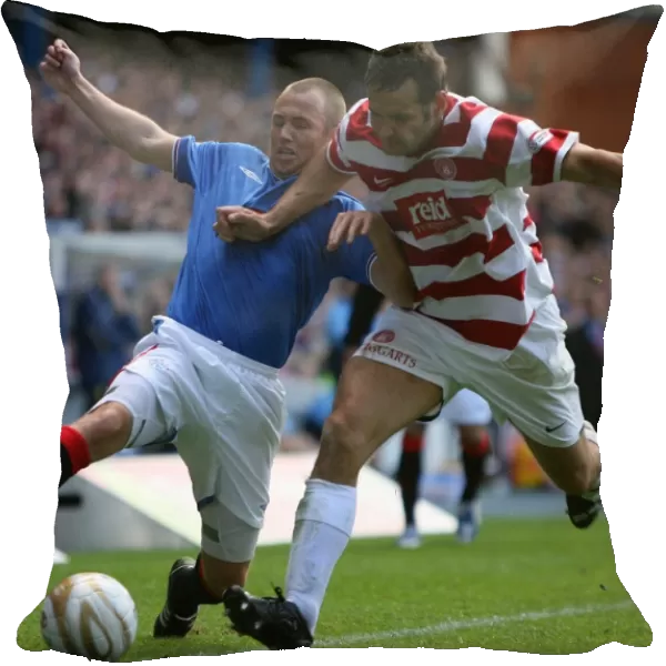 Intense Battle: Kenny Miller's Determined Fight for the Ball in Rangers Thrilling 4-1 Victory over Hamilton (Clydesdale Bank Premier League)