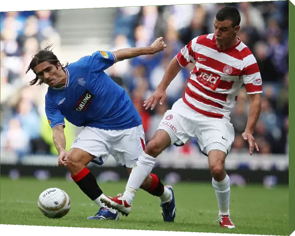 Intense Ibrox Rivalry: Pedro Mendes Fights for Possession in Rangers 4-1 Victory over Hamilton